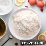 ingredients for raspberry olive oil cake in separate bowls.