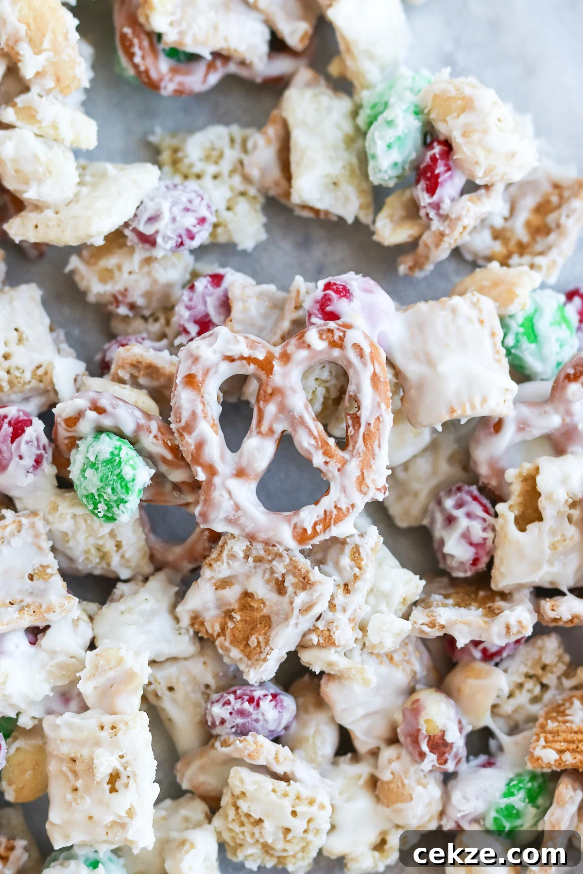 a closeup of Golden Grahams and pretzels coated in melted white chocolate. 