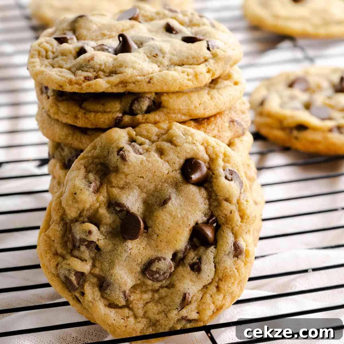Mrs Fields chocolate chip cookies copycat cookies stacked on a cooling rack.