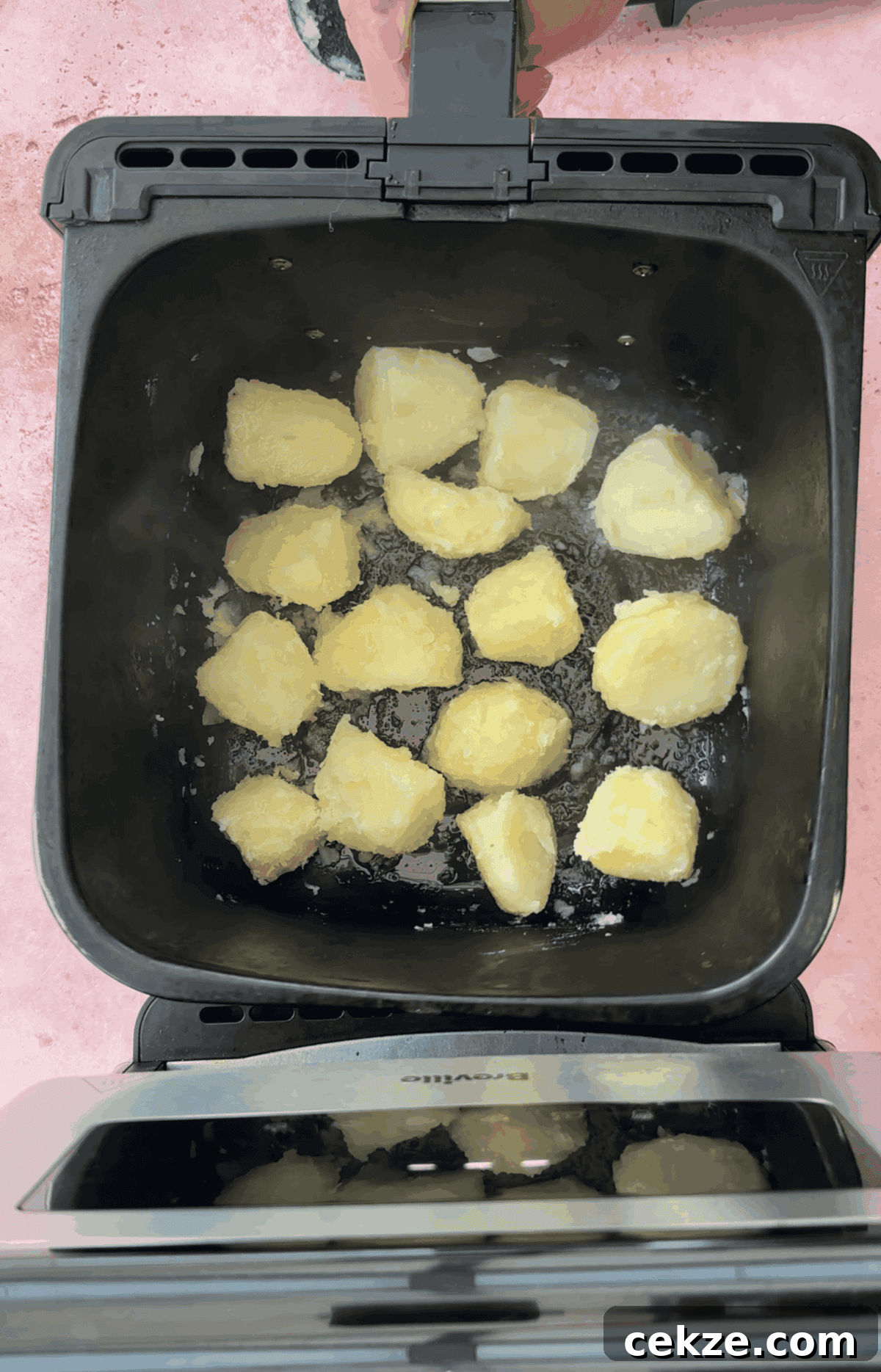 Crispy Air Fryer Roast Potatoes Recipe 6 Add the potatoes to the air fryer basket in an even layer and toss in oil and salt.