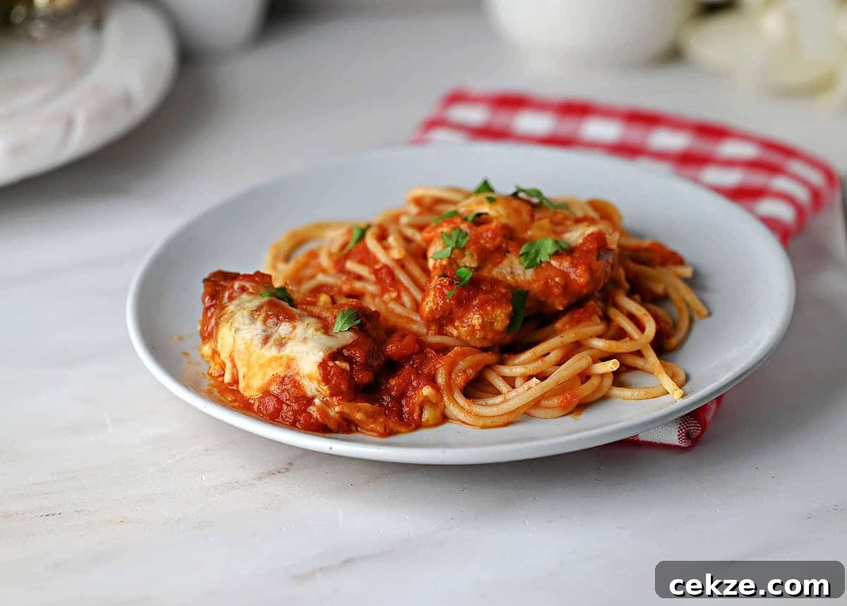 Crispy Pork Parmigiana with Tenderloin and Tomato-Basil Sauce 2 Pork Parmesan with spaghetti, ready to eat.