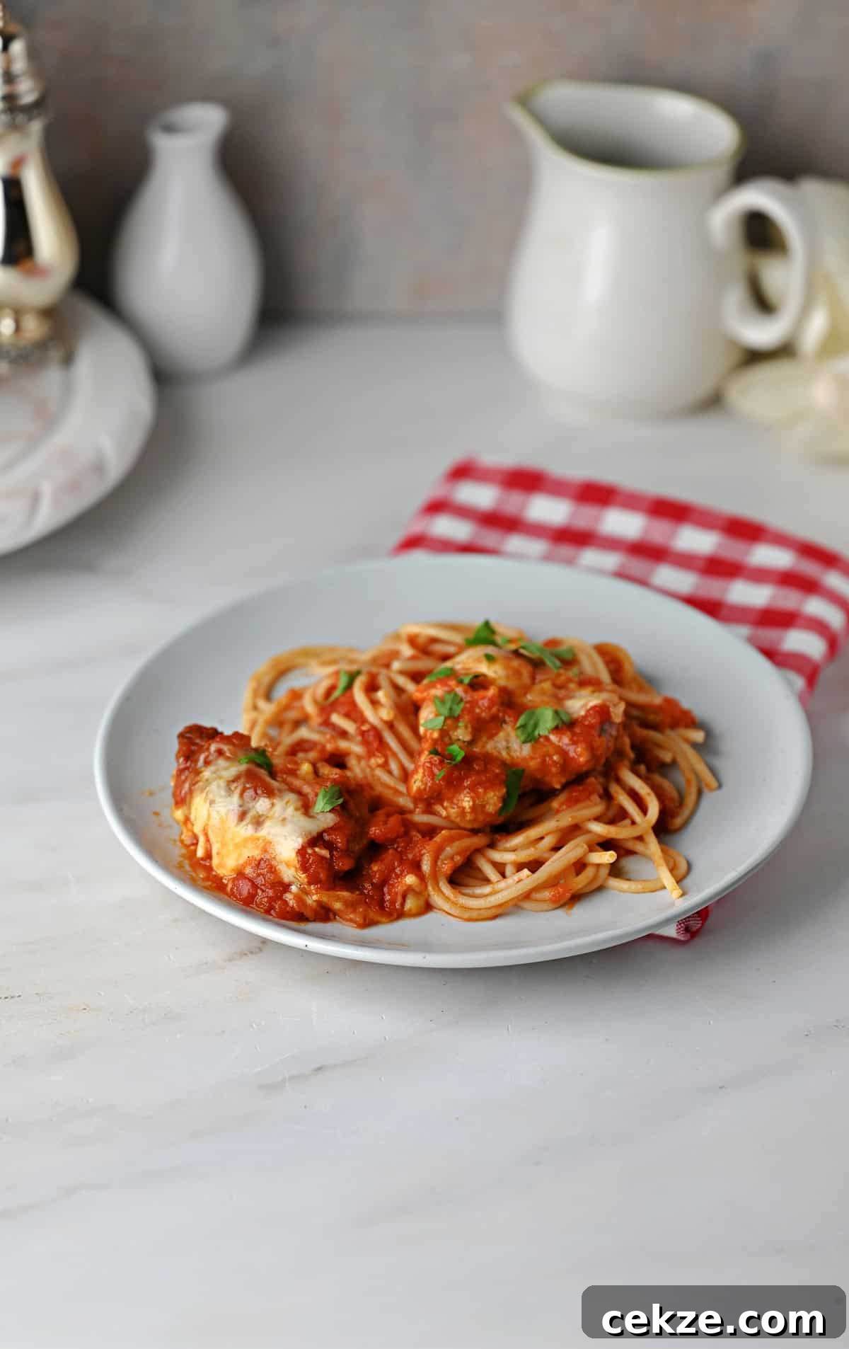 Crispy Pork Parmigiana with Tenderloin and Tomato-Basil Sauce 10 Pork Parmesan and sauce served on spaghetti noodles.