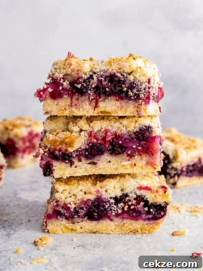 berry crumb bars stacked on top of each other