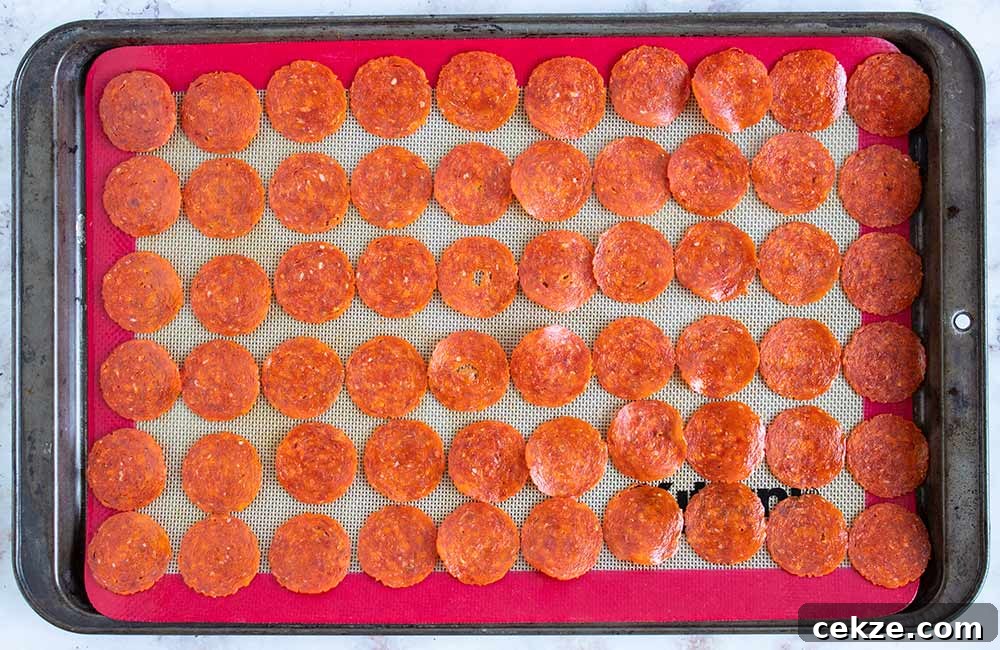 keto pepperoni chips on a baking sheet