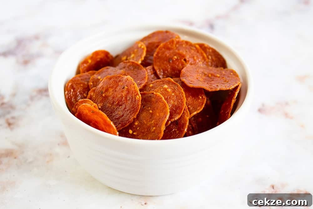 keto pepperoni chips in a white bowl on a countertop