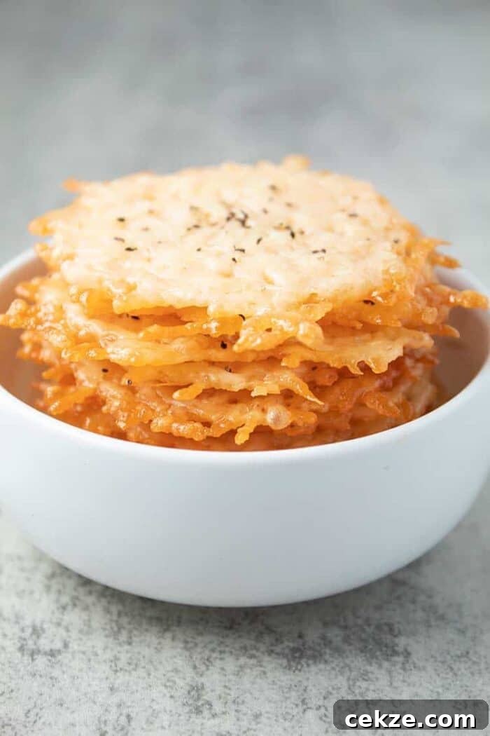 stack of parmesan crisps inside of white bowl
