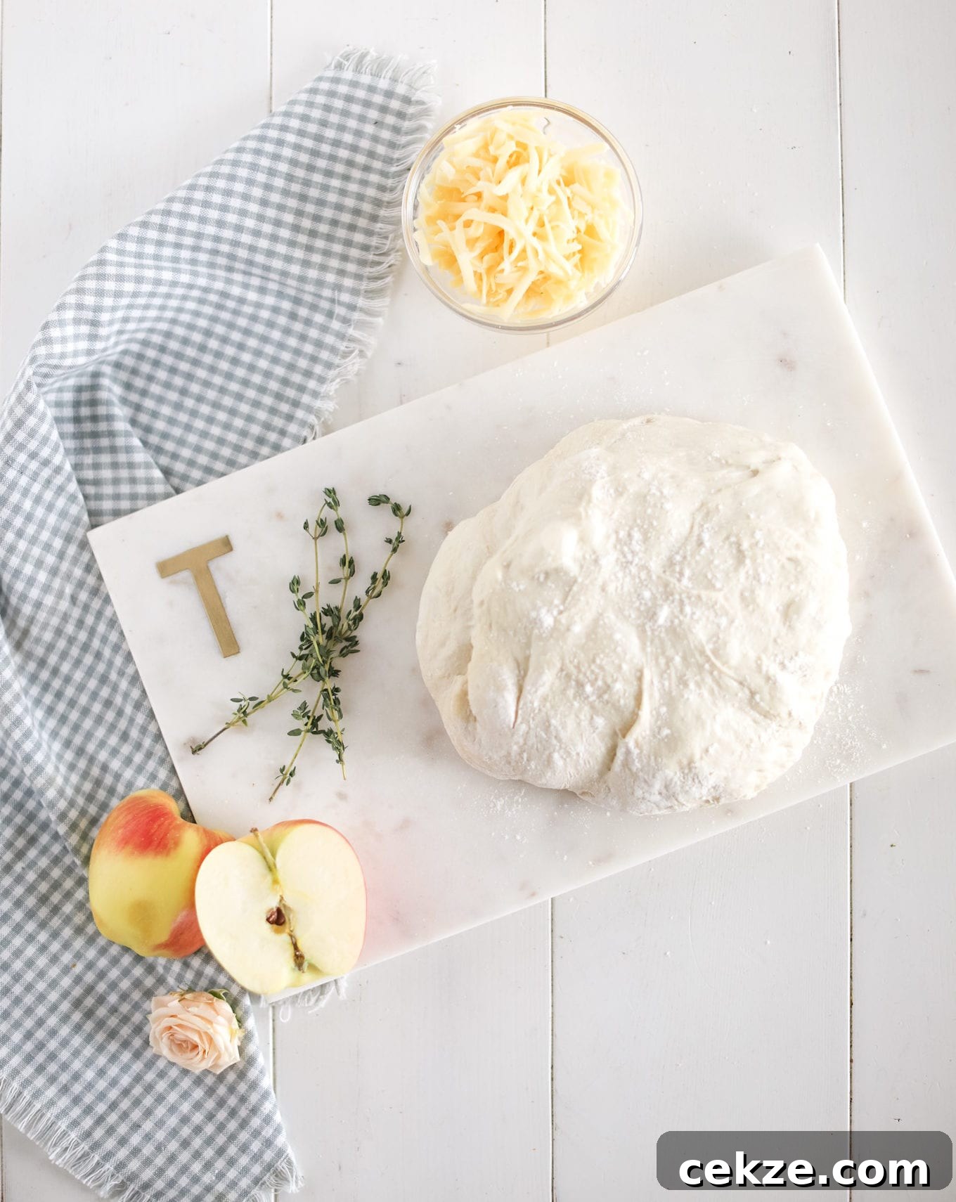 pizza dough with apples and cheese
