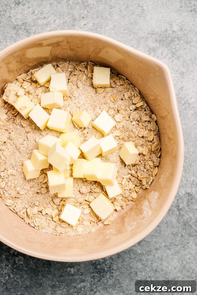 Perfect Peach Crisp Recipe for Summer Desserts 5 bowl of oats, sugar and cold butter cubes for crisp topping