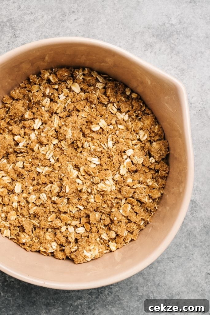 Perfect Peach Crisp Recipe for Summer Desserts 6 oat crumble topping in mixing bowl
