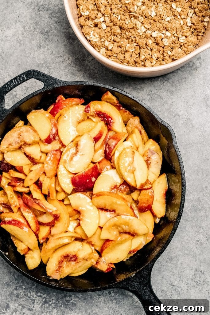 Perfect Peach Crisp Recipe for Summer Desserts 7 sliced peaches in cast iron skillet
