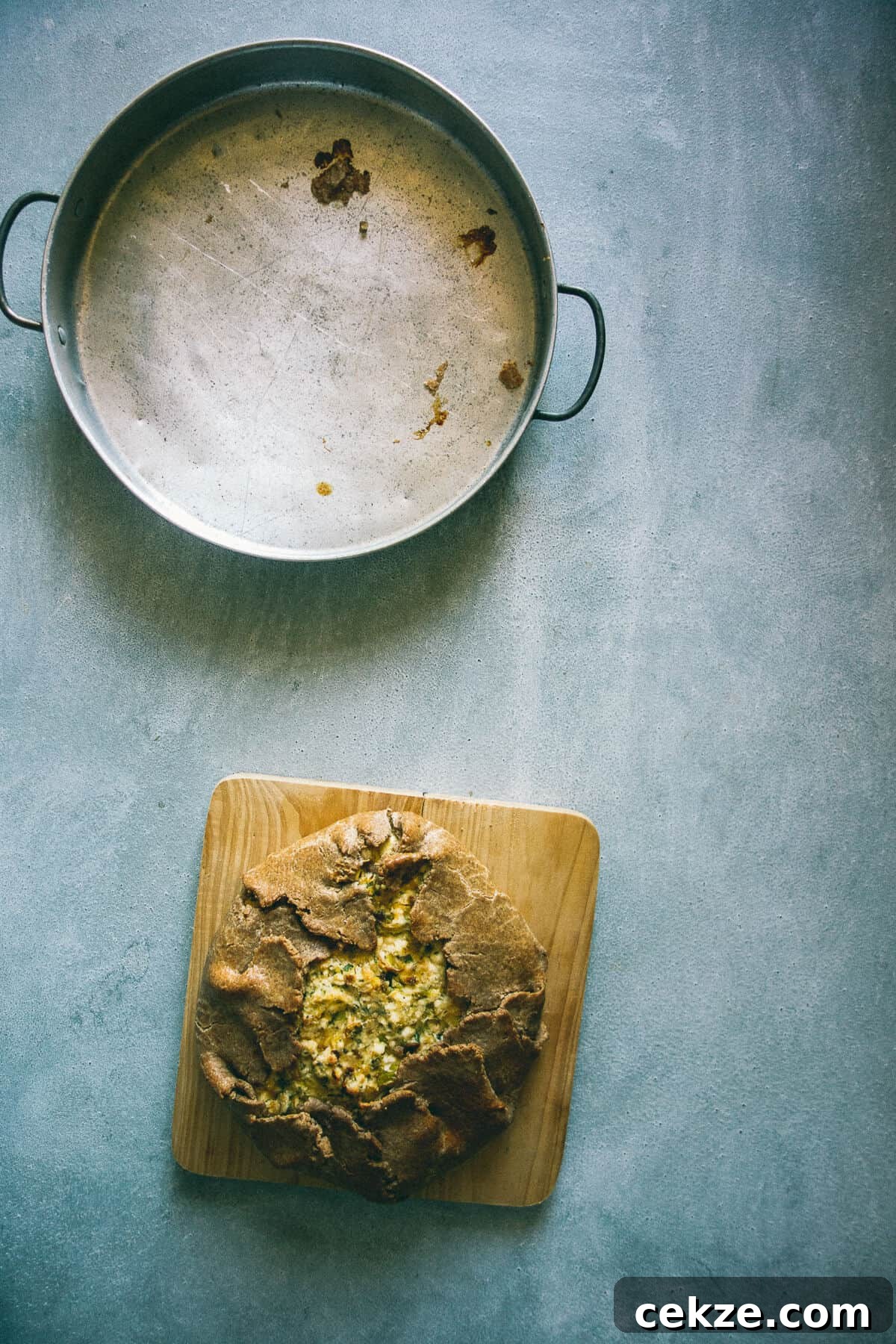 Leek and Cheese Pie Recipe: Flaky Savory Tart with Gruyère 6 a leek and cheese pie being served from a baking dish