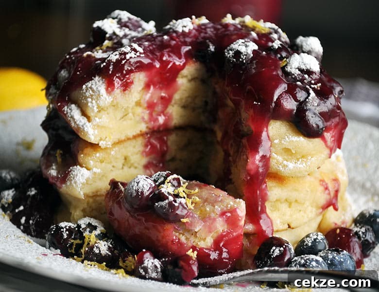 Lemon ricotta pancakes with blueberry sauce | ofbatteranddough.com
