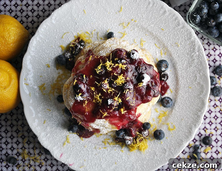 Lemon ricotta pancakes with blueberry sauce | ofbatteranddough.com