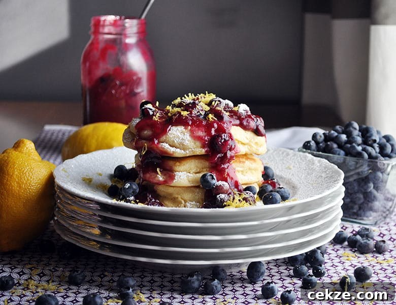 Lemon ricotta pancakes with blueberry sauce | ofbatteranddough.com