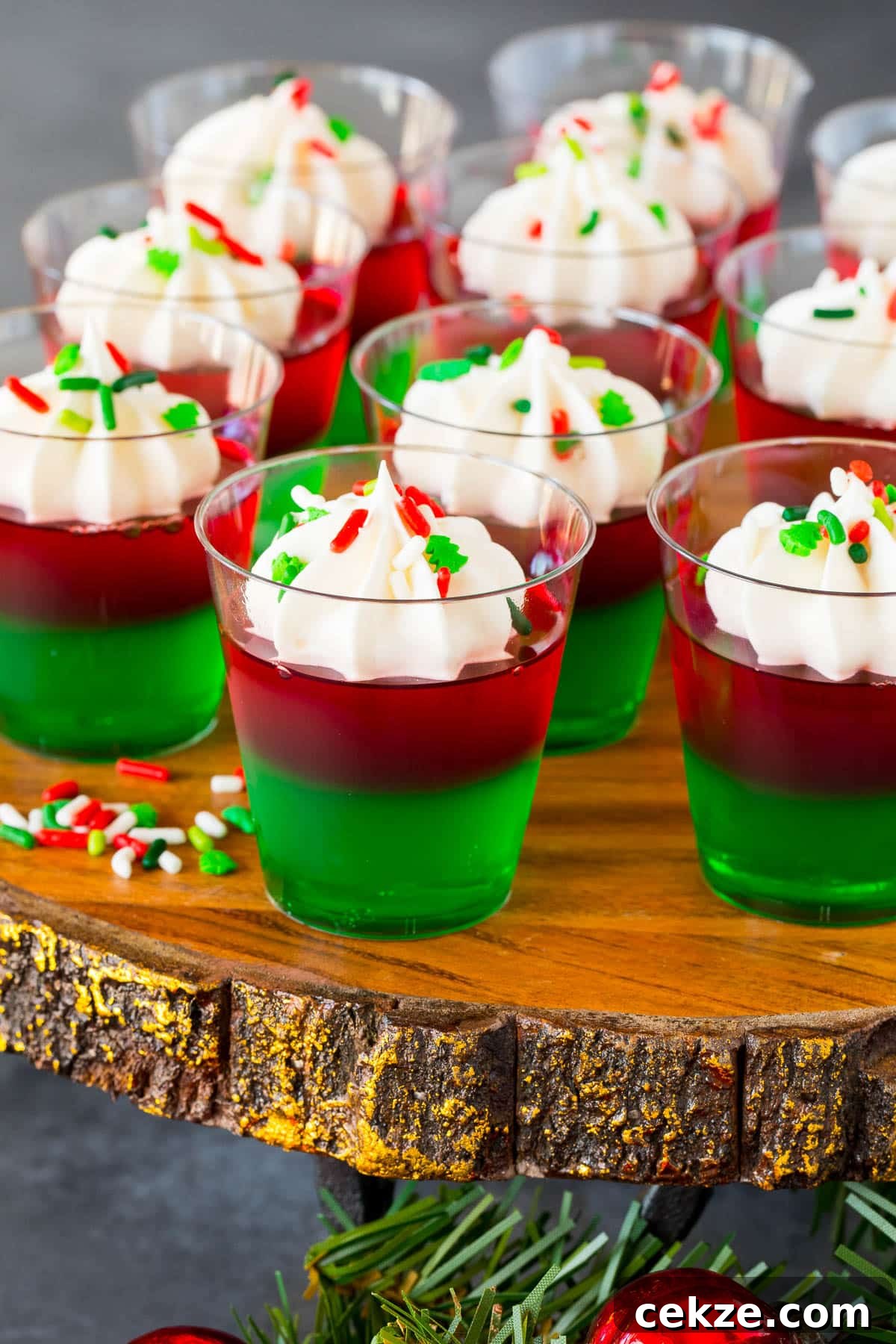 Festive Christmas Jello Shot Recipes for Holiday Parties 6 A tray of Christmas Jello shots decorated with sprinkles.