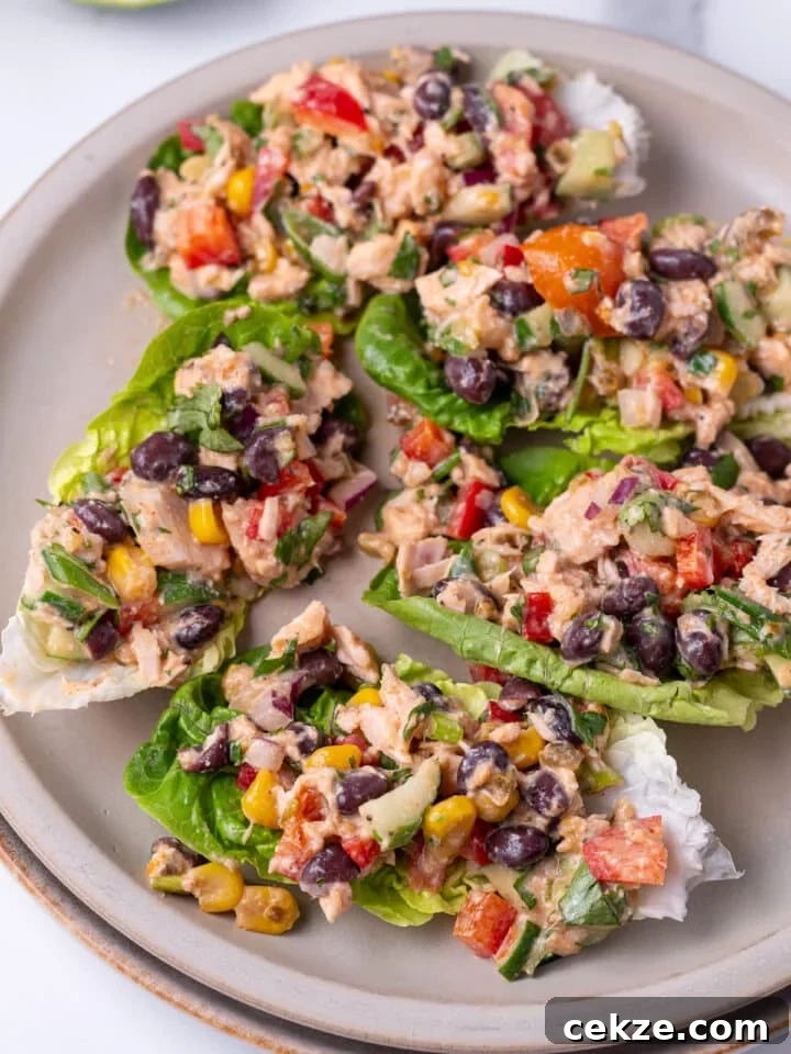 close up view of tuna salad with Mexican variety scooped into lettuce leaves