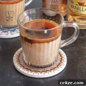 Iced caramel macchiato in tall glass