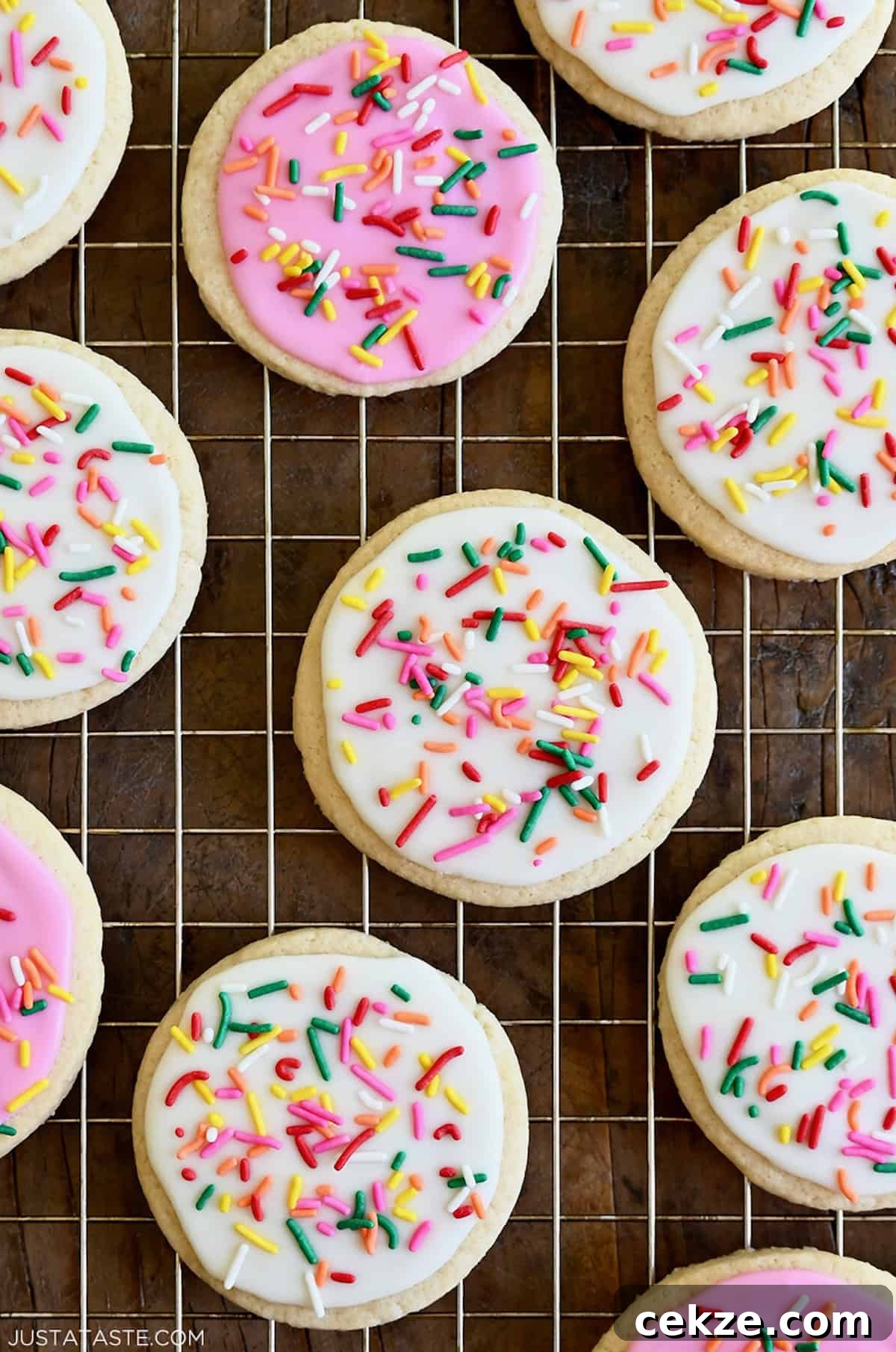 Perfect Sugar Cookie Icing Recipe for Smooth, Glossy Frosting 6 Homemade sugar cookies frosted with the best sugar cookie icing in vibrant pink and bright white.