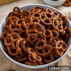 Cracked Pretzel Snack Recipe: Sweet-Salty Caramel Pretzels 8 Seasoned pretzels and a white serving bowl.