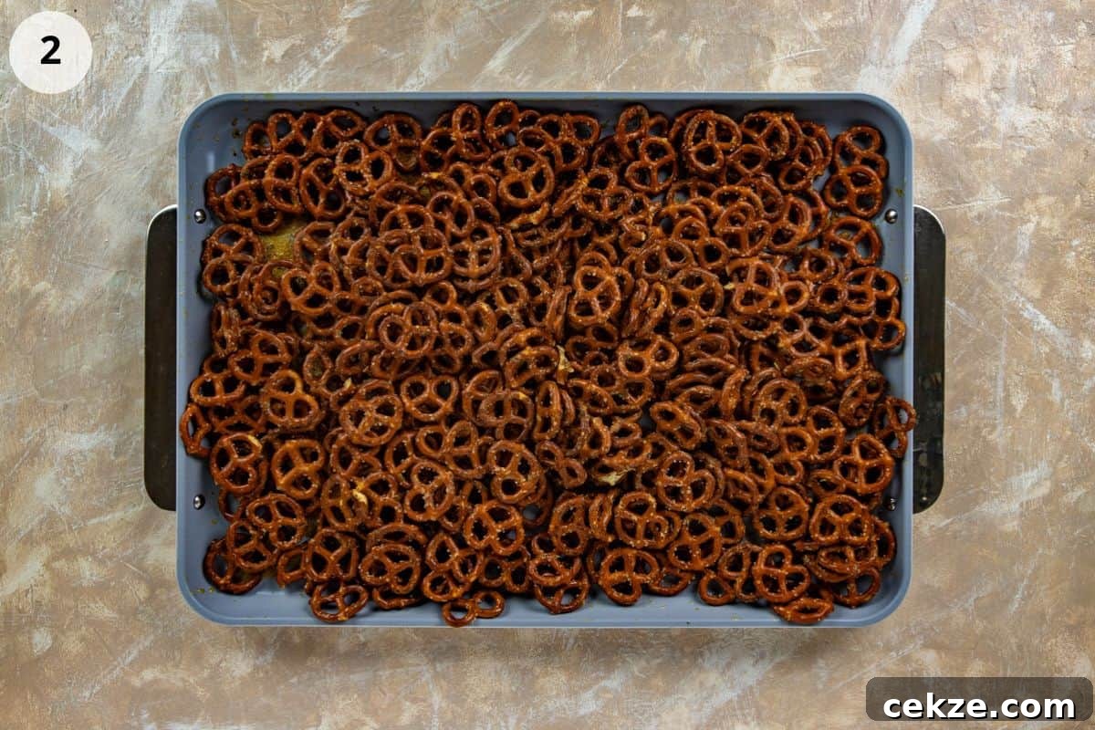 Cracked Pretzel Snack Recipe: Sweet-Salty Caramel Pretzels 5 Seasoned pretzels on a sheet pan.