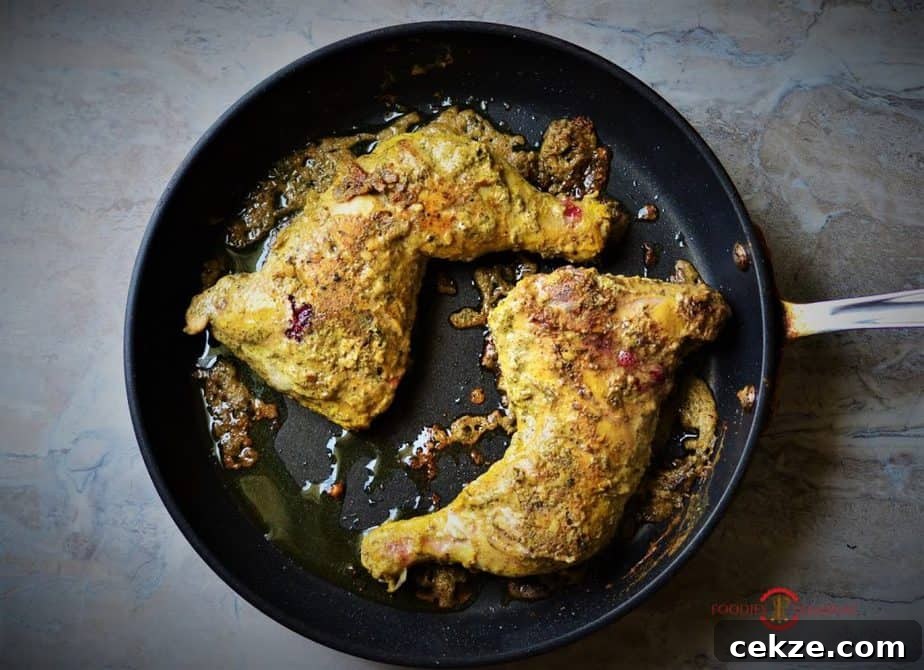 Authentic Afghani Chicken Roast Recipe from Mughlai Cuisine 3 Afghani Chicken roasted on the pan.