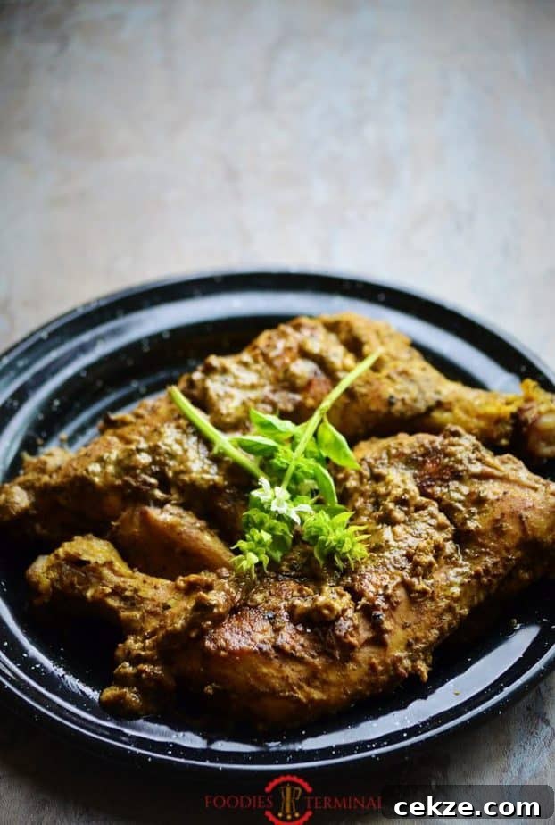 Authentic Afghani Chicken Roast Recipe from Mughlai Cuisine 5 Afghani Chicken Roast placed over a plate.
