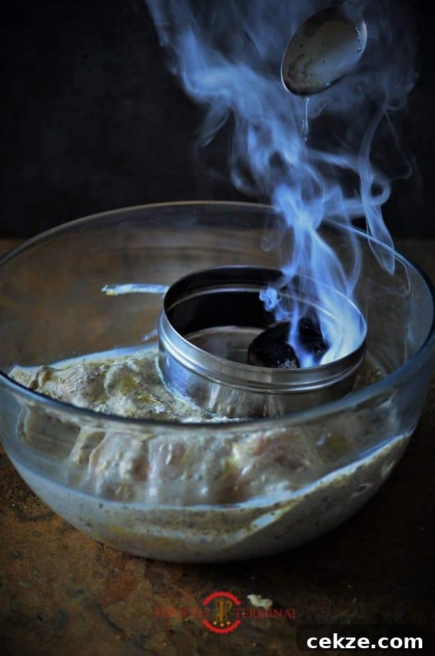 Authentic Afghani Chicken Roast Recipe from Mughlai Cuisine 6 Charcoal smoke over the marinated chicken.