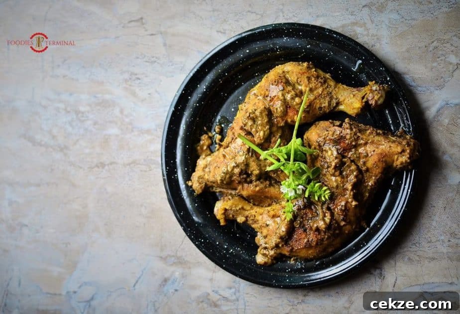 Authentic Afghani Chicken Roast Recipe from Mughlai Cuisine 7 Afghani Chicken served on a plate.