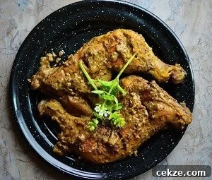 Authentic Afghani Chicken Roast Recipe from Mughlai Cuisine 10 Afghani Chicken roast served on a plate.