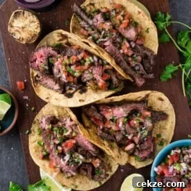 Carne Asada Skirt Steak Tacos with Citrus Garlic Marinade 8 Carne Asada Tacos on a platter.