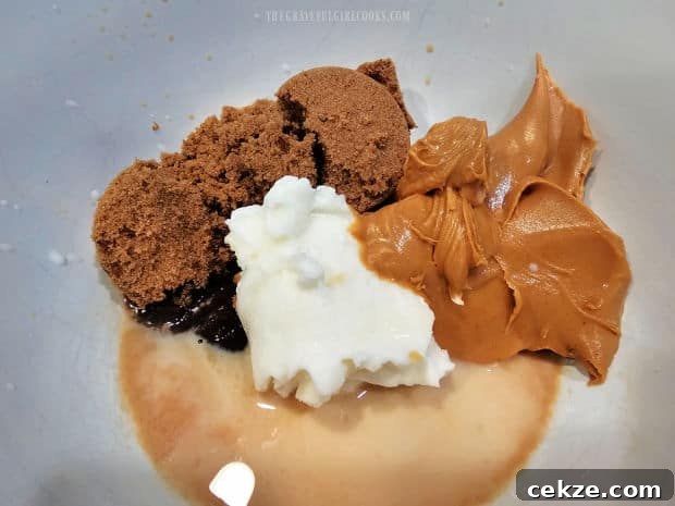 Peanut butter, shortening, brown sugar, milk and vanilla in mixing bowl.