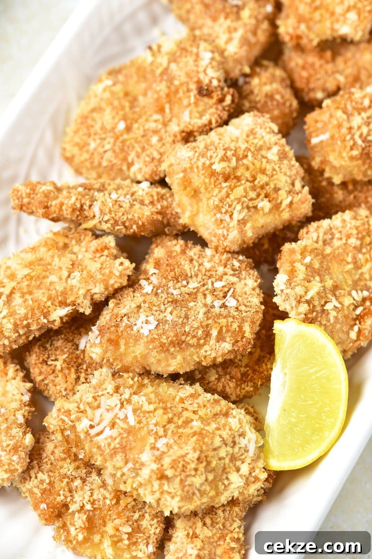 Homemade Turkey Nuggets (Gluten-Free, Dairy-Free) Homemade turkey nuggets on a white plate.