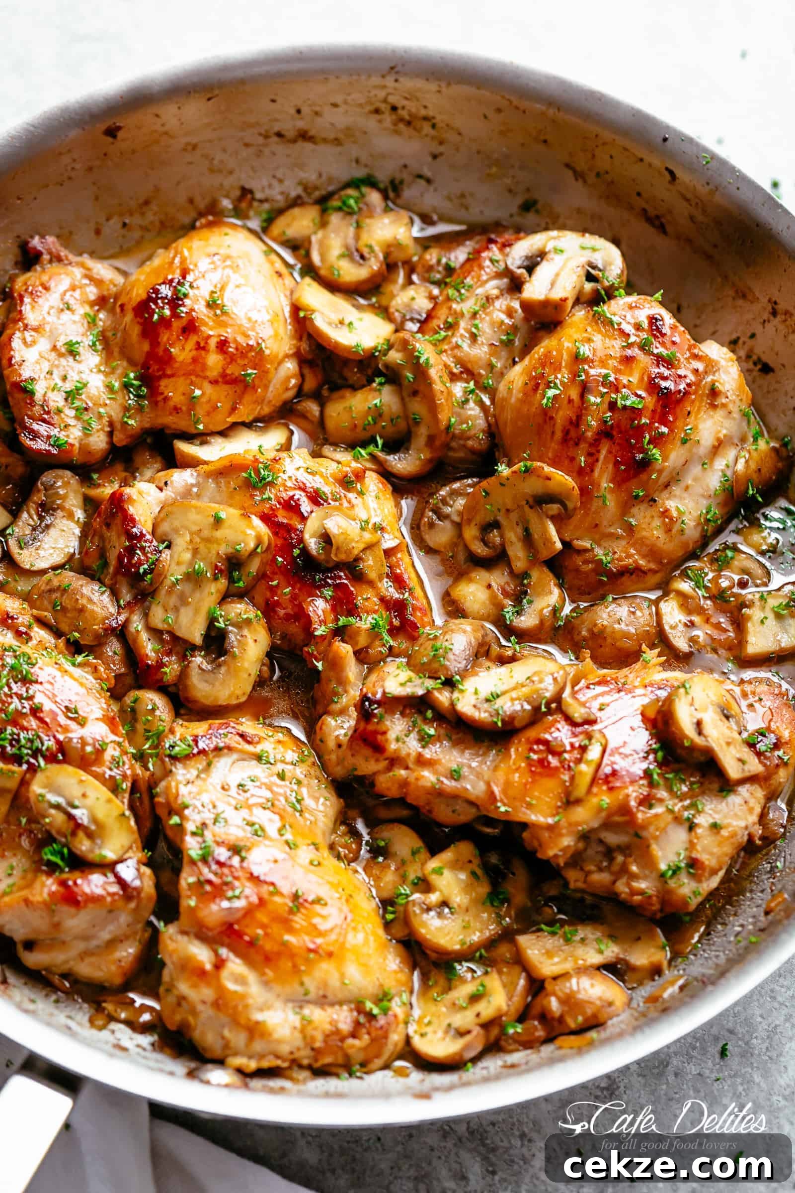 Golden seared chicken thighs in a delicious, buttery garlic mushroom sauce with a sprinkle of herbs is THE weeknight dinner everyone raves about! Serve over rice, pasta, mashed potatoes OR lower carb options like mashed cauliflower or zucchini noodles!