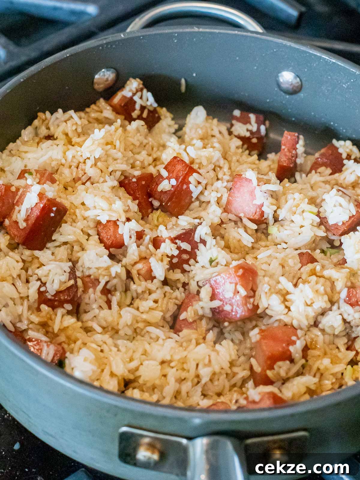 fried spam and rice in a nonstick pan