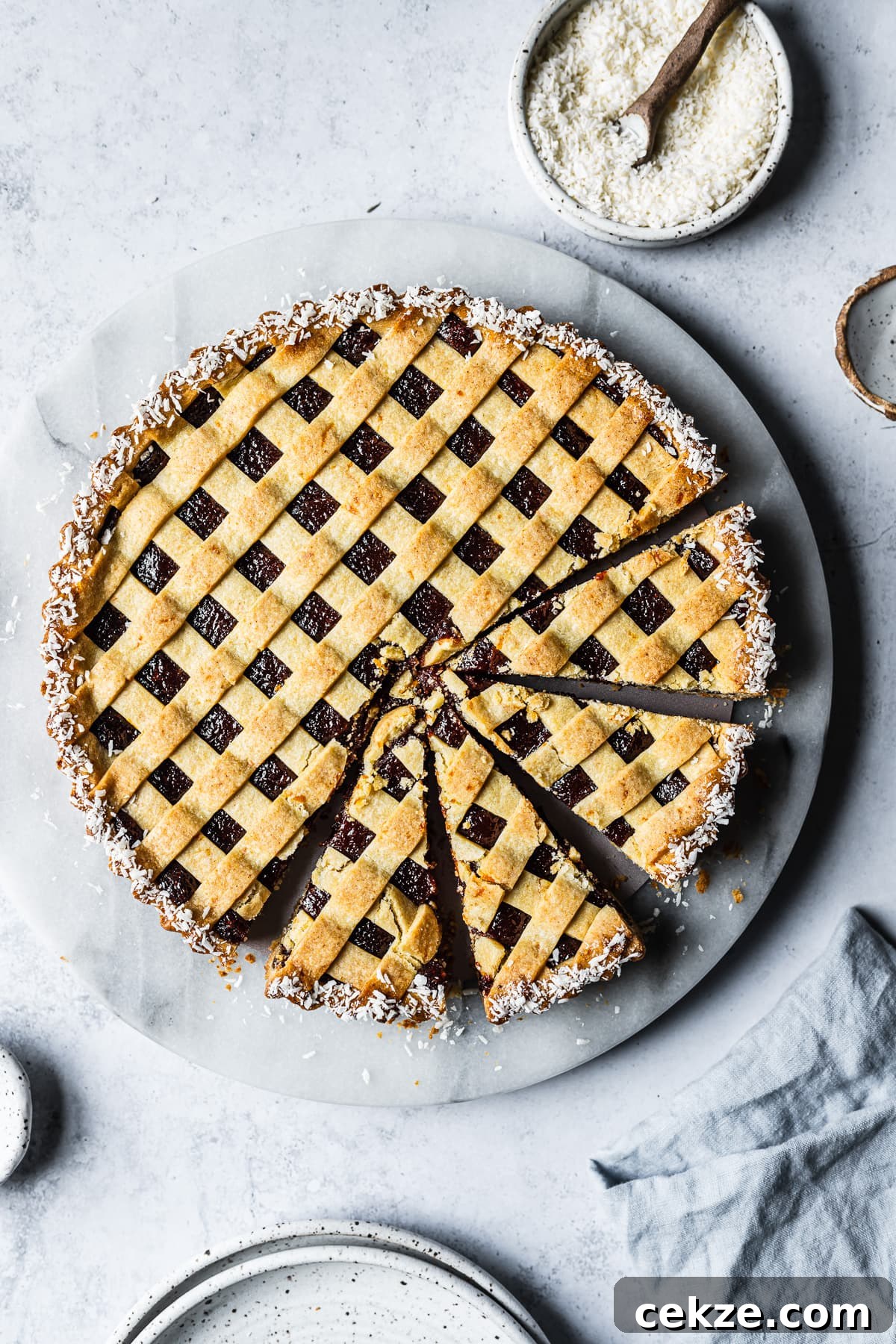 A baked pasta frola four slices cut from the tart.