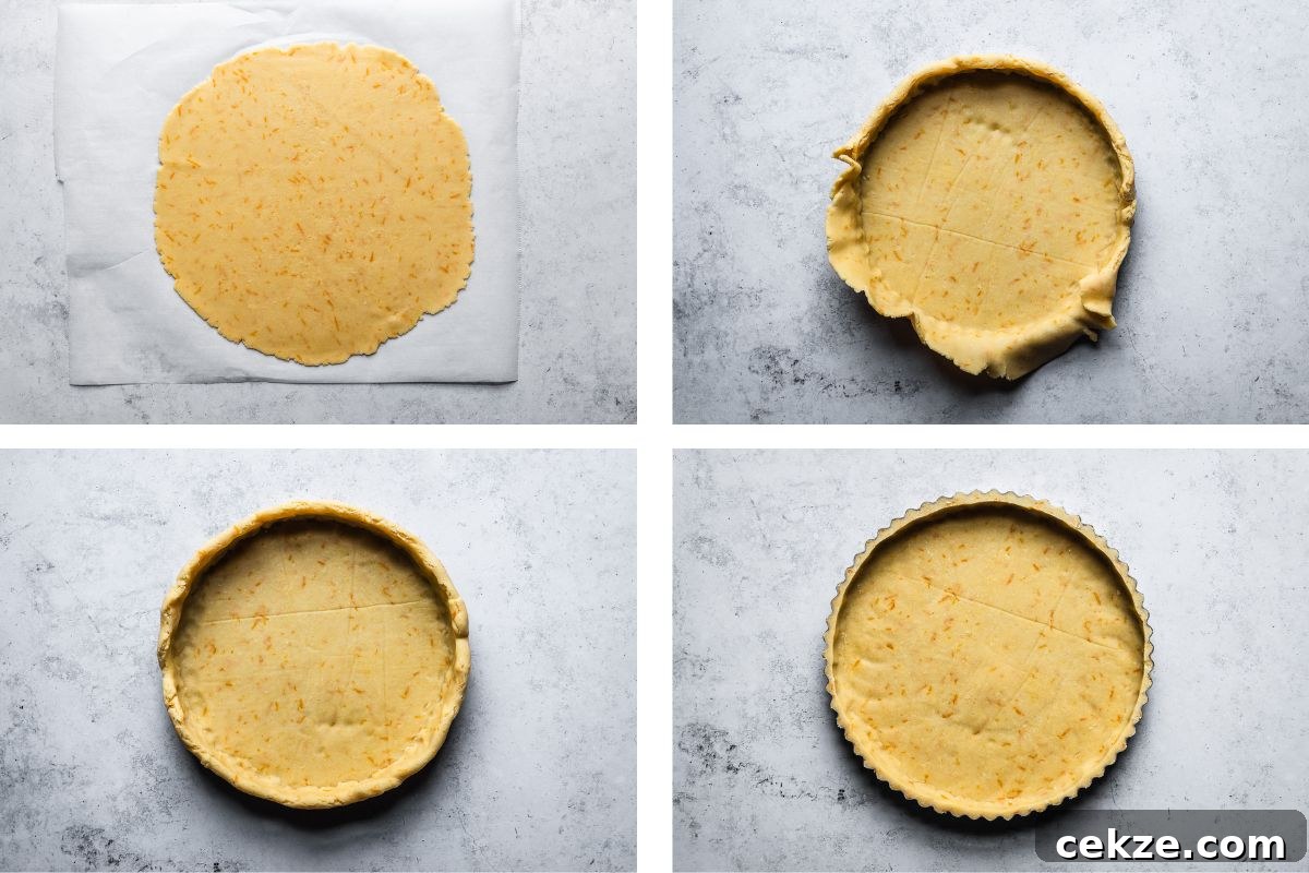 Tart dough being rolled out and placed into a tart pan.