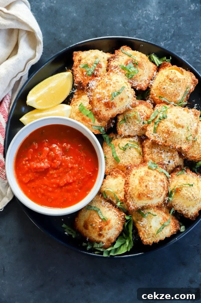 toasted cheese pasta on a plate with dipping sauce