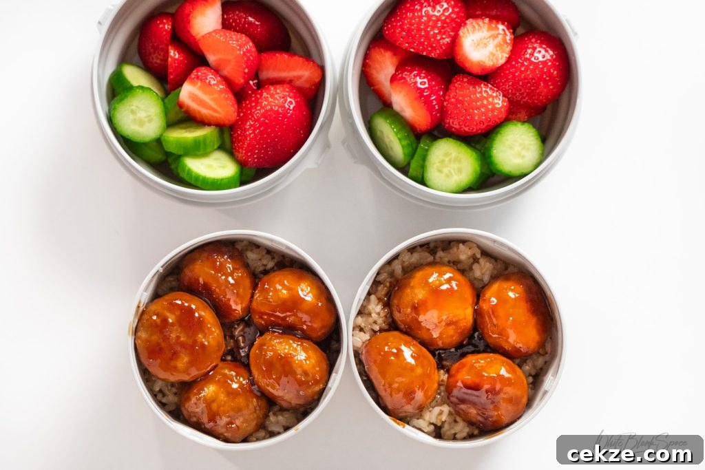 Teriyaki Chicken Meatballs for Packed School Lunches 2 my kids lunch jars packed with teriyaki chicken meatballs, rice, strawberries, and cucumber