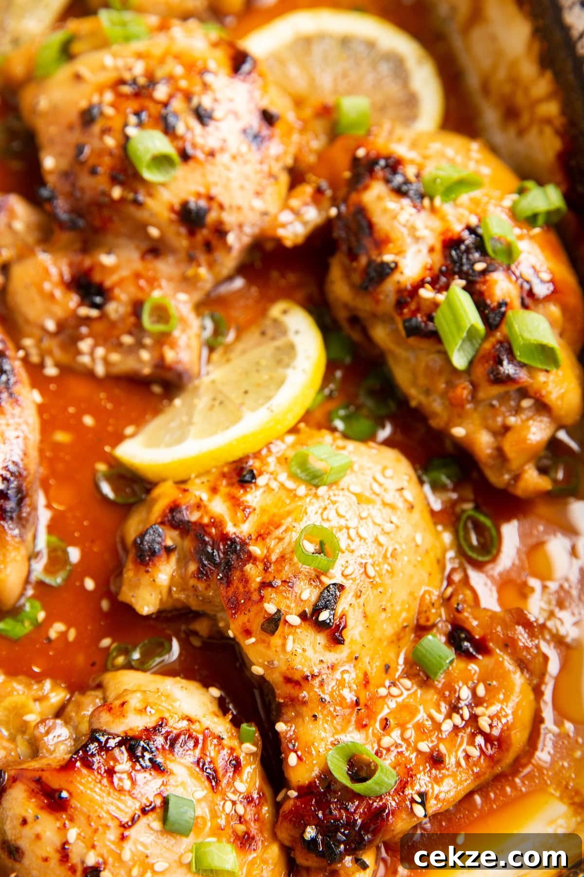 Top Chicken Thigh Recipes for Flavorful Weeknight Dinners 11 Honey Lemon Garlic Baked Chicken Thighs in a casserole dish
