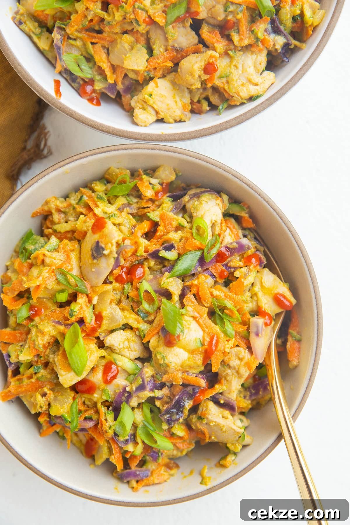 Top Chicken Thigh Recipes for Flavorful Weeknight Dinners 15 close up two bowls of Thai zucchini and chicken