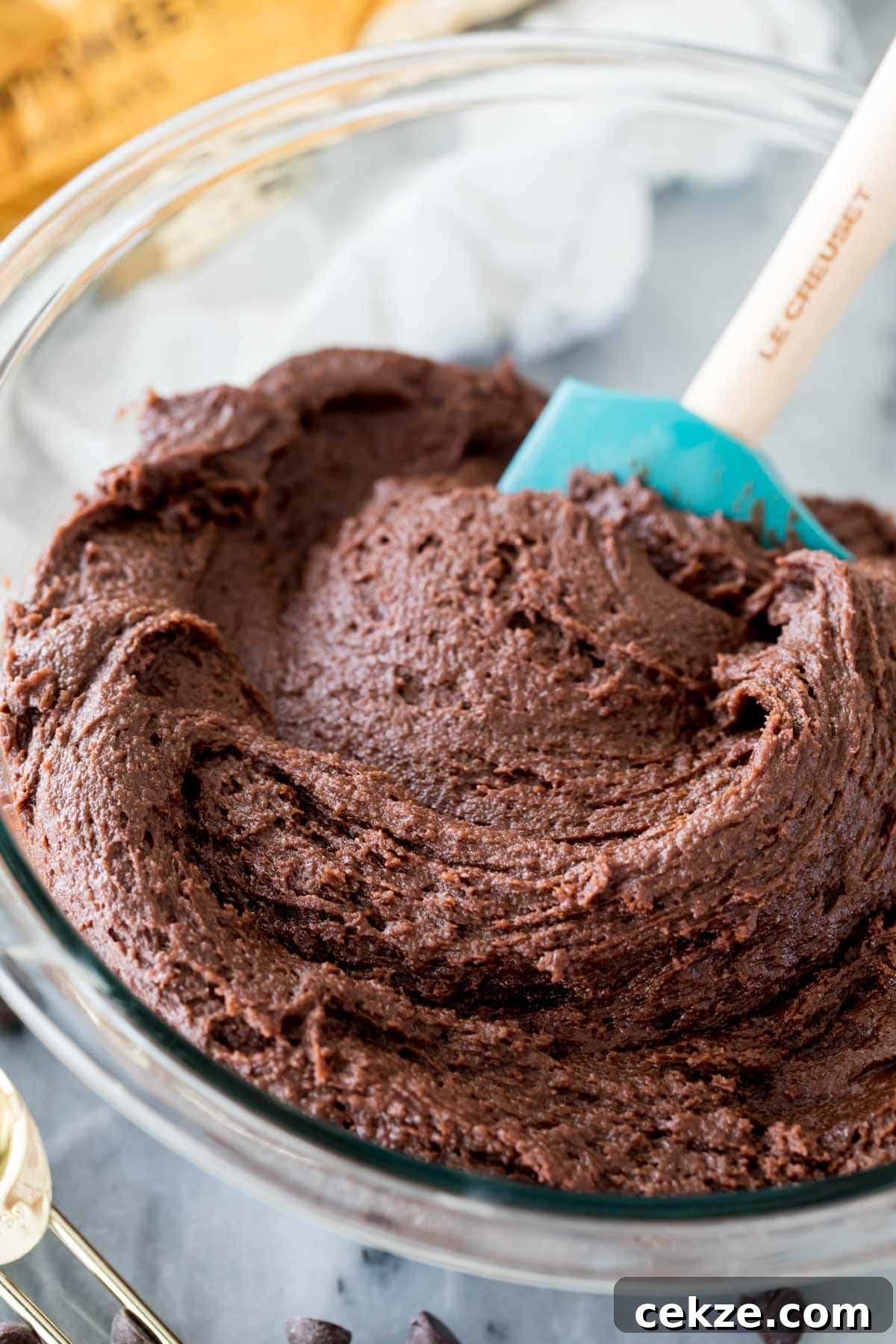 chocolate cookie batter in glass bowl