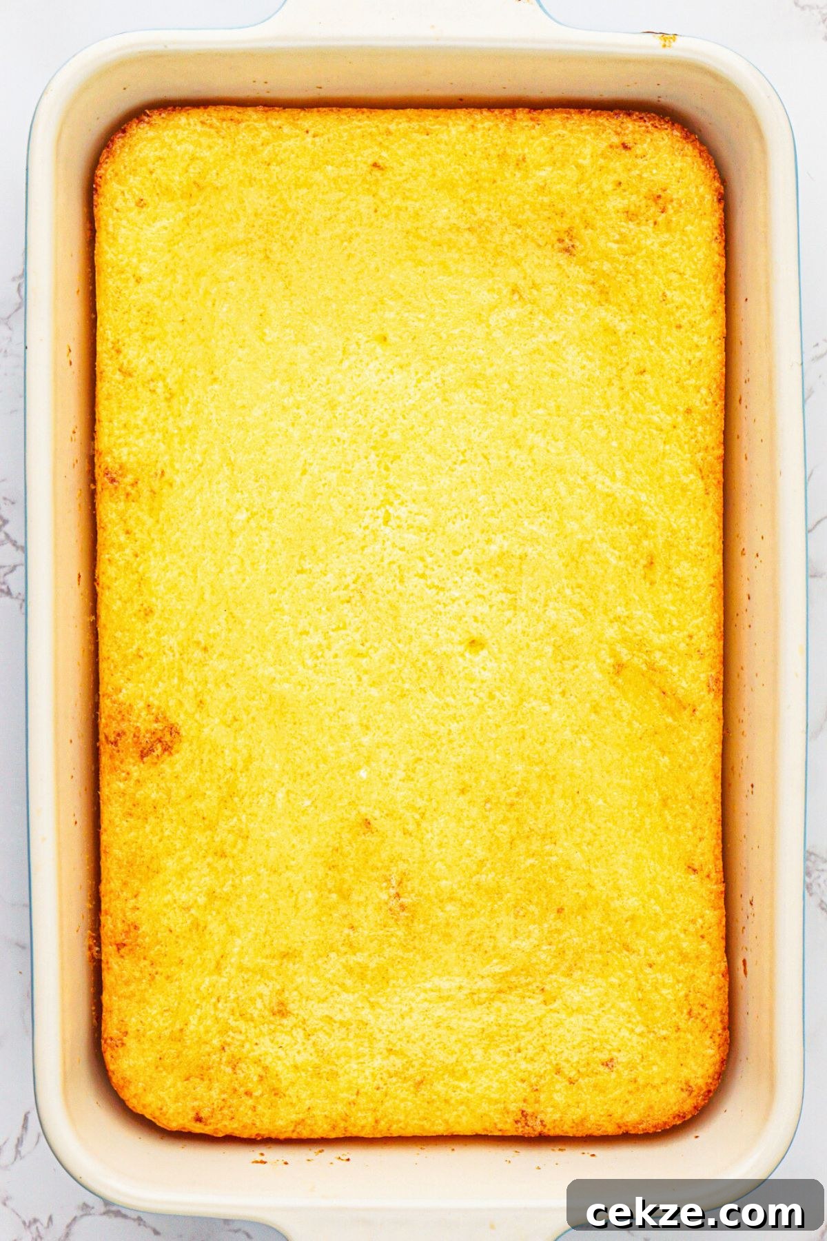 2-Ingredient Lemon Bars Recipe — Quick Tangy Dessert 6 Lemon cake mix and pie filling in pie dish after they have been mixed and baked in a 9x13 baking dish.