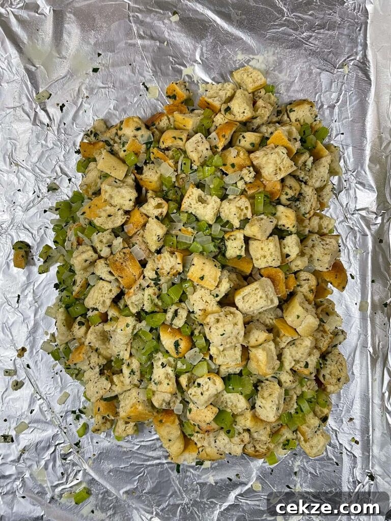 Stuffing shaped into a tight square on a foil-lined baking sheet.