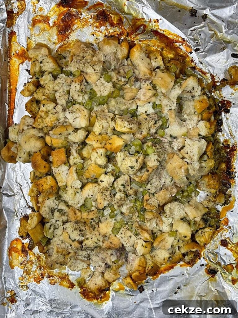 Stuffing exposed on the baking sheet after removing the turkey.