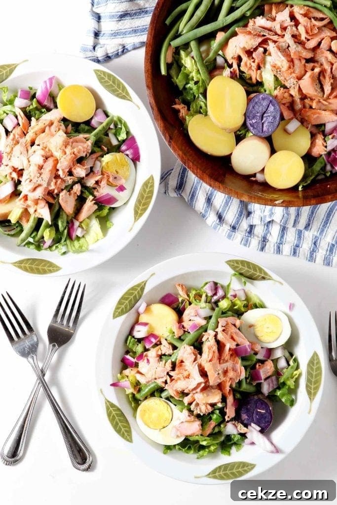 Grilled Salmon Niçoise Salad Recipe with Lemon Vinaigrette 6 two nicoise salads in white bowls