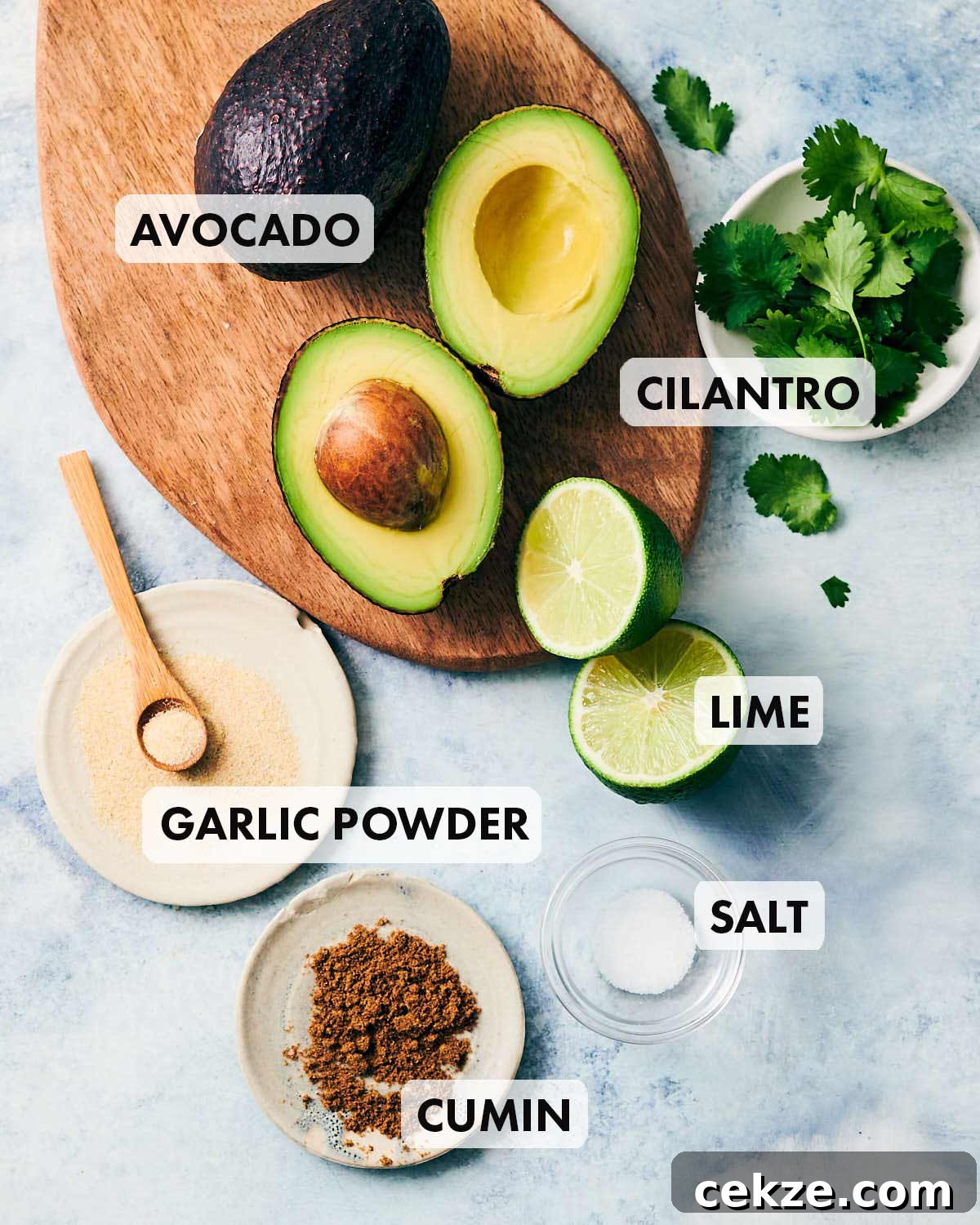 Ingredients to make vegan guacamole without tomatoes.