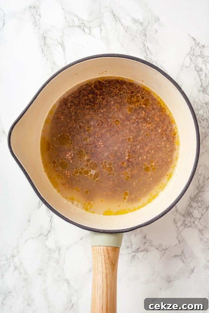 Overhead view of bulgur soaking in saucepan