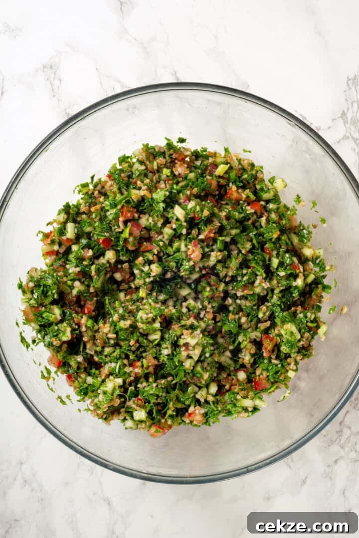 Overhead view of tabbouleh in mixing bowl