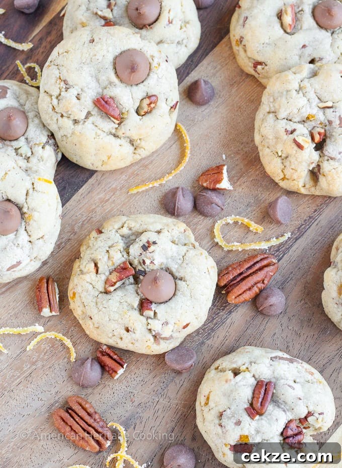 Soft, chewy cinnamon milk chocolate chip cookies with toasted pecans and candied orange peel. These Orange Pecan Milk Chocolate Chip cookies will have you reaching for another before you realize what you’re doing!