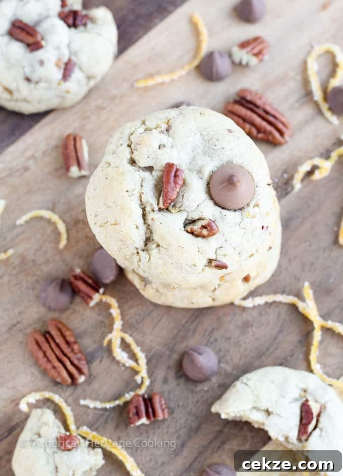 Soft, chewy cinnamon milk chocolate chip cookies with toasted pecans and candied orange peel. These Orange Pecan Milk Chocolate Chip cookies will have you reaching for another before you realize what you’re doing!